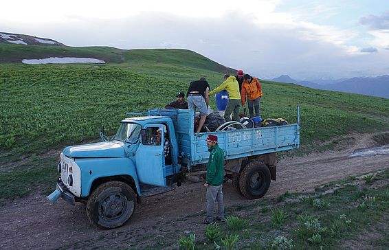 Our equipment en route from Jirgatol to the base camp in a more suited cargo-truck. On top of the truck: Evan Miles and Marin Kneib didn’t have a seat in the 4x4s, and endured 3 hours avoiding the black exhaust fumes but admiring epic landscapes. Photo: A. Jouberton