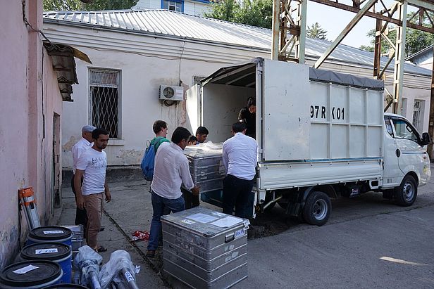 Marin Kneib and Tajik scientists loading our equipment to go from Dushanbe to Jirgatol. Photo: A. Jouberton