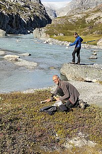 Photo 15: My two research colleagues, David Janssen (EAWAG) and Anders Prieme (University of Copenhagen), collecting water and soil samples at a glacial stream (Photo credit: Christiane Leister)